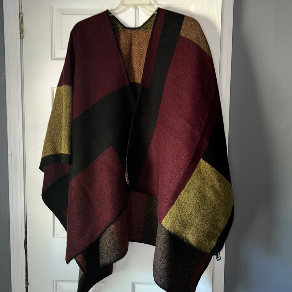 Express poncho. Burgundy, gold tan, and black.